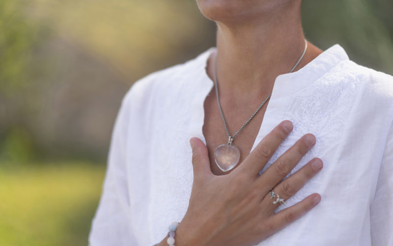 Spirituality, hand on heart, gesture of inner meaning. Image iStock microgen