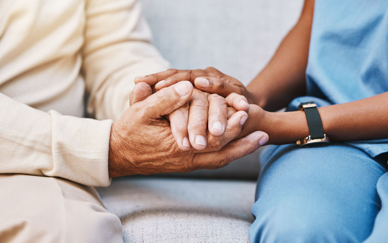 Nursing help at home, medical caregiver and client. Image iStock tPeopleImages