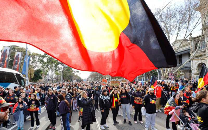 People holding flags participate in the annual Victorian NAIDOC march. The 2025 NAIDOC March (National Aborigines and Islanders Day Observance Committee) brought together first nations communities and allies to celebrate Aboriginal and Torres Strait Islander cultures, advocate for justice and honour the ongoing struggle for Indigenous rights and sovereignty. The annual event featured speeches, performances and a march highlighting this years theme of resilience and selfdetermination. NAIDOC Week has its roots in the 1938 Day of Mourning protest, one of the first major civil rights gatherings. Image Alamy SIPA USA Image ID 3BR6XMF