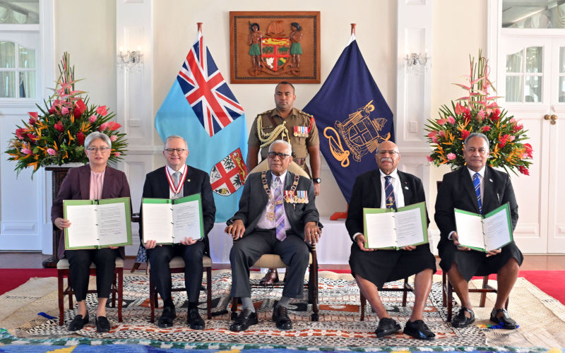 Australias Minister for Foreign Affairs Penny Wong, Prime Minister Anthony Albanese, Fijis President Ratu Naiqama Lalabalavu, Fijis Prime Minister Sitiveni Rabuka and Minister for Foreign Affairs Sakiasi Raisevu Ditoka pose for photos after signing a treaty and an alliance at State House in Suva, Fiji, Monday, July 6, 2026. AAP Image Mick Tsikas