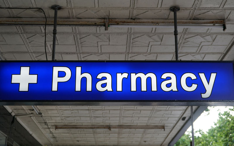 Universal Pharmacy neon sign above the entrance to the chemist. Image iStock Catrin Haze
