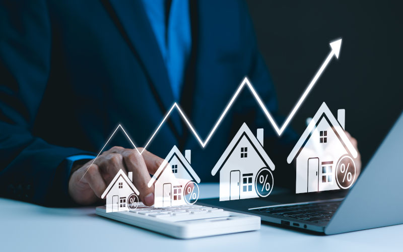 Real Estate Investment and Market Growth Concept. Analyzes real estate market growth trends. Graph show rising house price, interest rate, property mortgage, loan home, and investment opportunities. Image iStock CreditSupatman