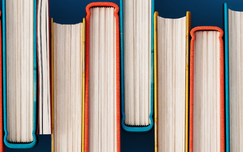 Top view on colourful stacked books. Image iStock Ilija Erceg