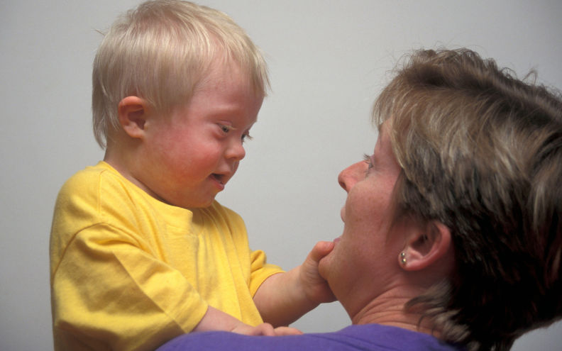 Happy interaction between mother and her downs syndrome son. Image Alamy Angela Hampton Picture Library. Image Angela Brampton. Image ID 2E4F1WK