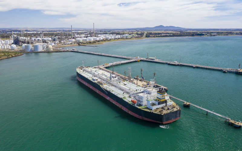 Aerial photo of oil tank and oil refinery in the background Image iStock ymgerman