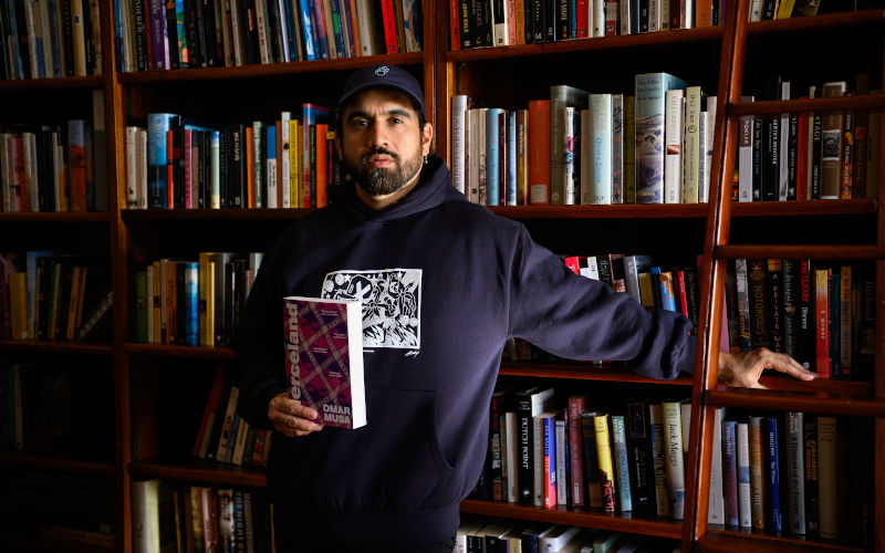 Winner of the 2026 Miles Franklin Literary Award Omar Musa poses for a photograph at the State Library NSW, in Sydney, Wednesday, August 5, 2026. Image AAP Bianca De Marchi