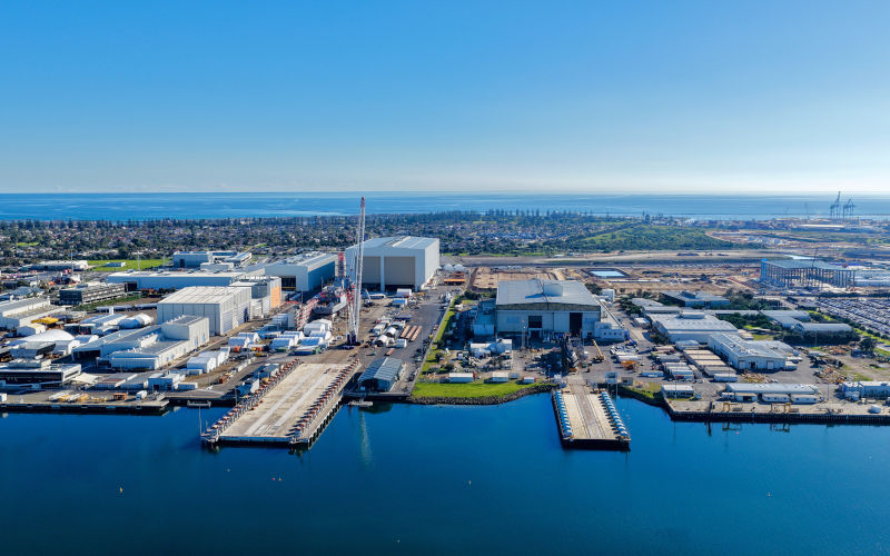 Aerial view of Osborne, South Australia, featuring the ASC Shipyard, Port River, Torrens Island, industrial waterfront, shipping facilities, and surrounding coastal wetlands. Image iStock iTraveller