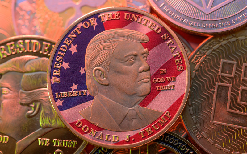 Brussels, Belgium. 02nd Mar, 2025. Representation of the $Trump meme coin together with Bitcoin and crypto coins, seen in this photo illustration. Taken in Brussels, Belgium, On 2 March 2025. Image Jonathan Raa Sipa USA Alamy Live News Image ID 3A04KTE