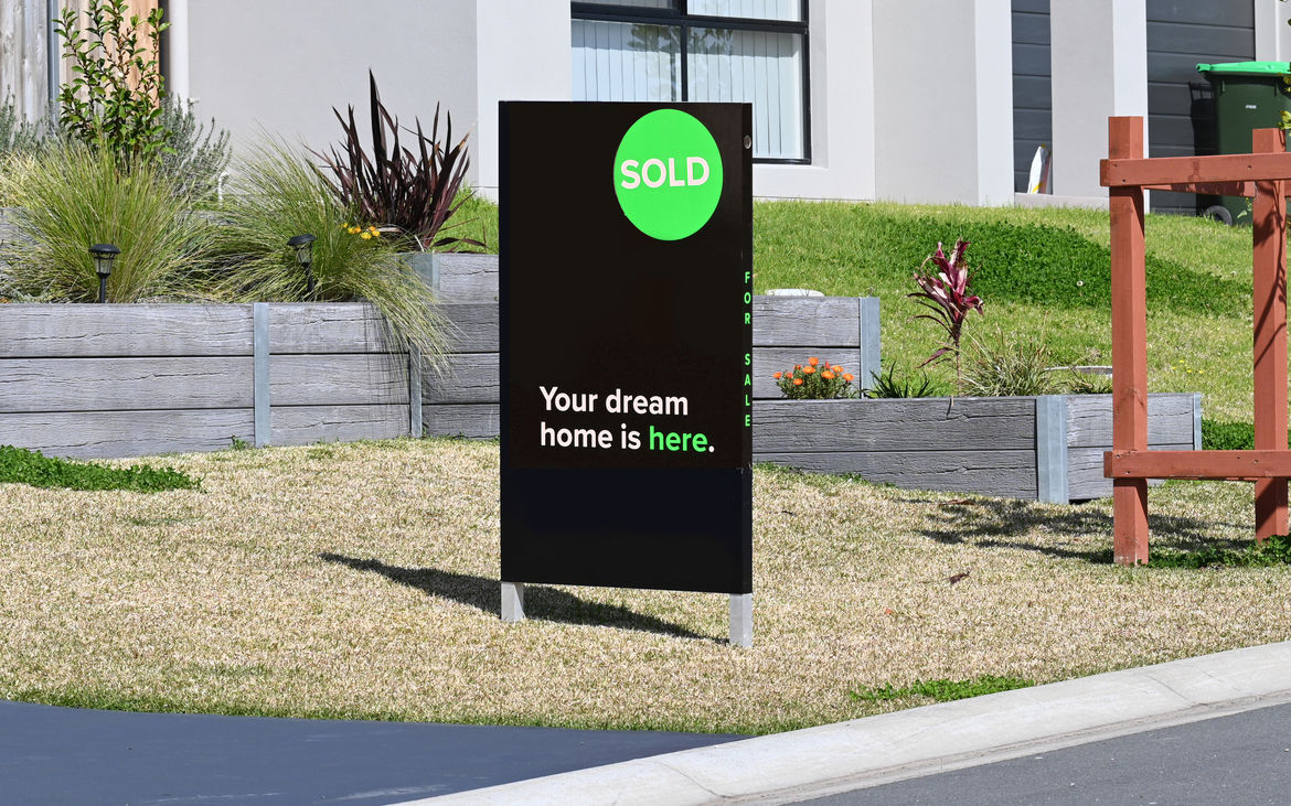 Home for sale sign with sold on the front of the board. Image iStock Douglas Cliff