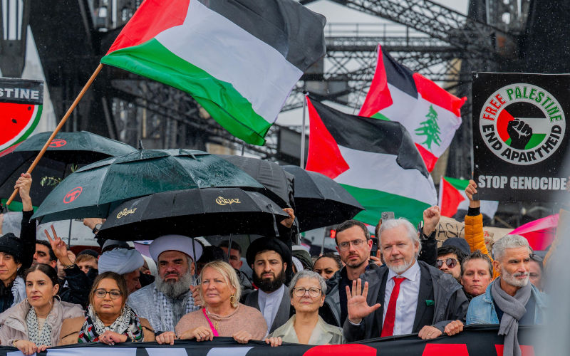 Sydney, Australia. 03rd Aug, 2025. Julian Assange is seen during the ProPalestinian march across the Sydney Harbour Bridge. Beside him is Mary Kostakidis and behind is Gabriel Shipton. Protesters in Sydney and Melbourne joined marches and actions globally, as pressure mounts on the Israeli government over a devastating humanitarian crisis unfolding as its war against Hamas continues. Image SOPA Images Limited Alamy Live News Alamy image ID 3C8DE70
