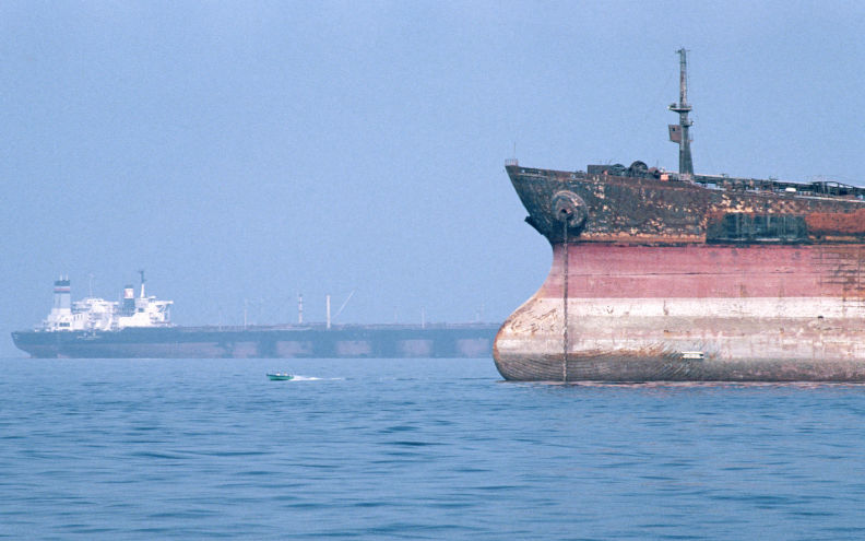 Oil supertankers anchored at the Bandar Abbas Anchorage, in the Straits of Hormuz, bridging the Persian Gulf and the Gulf of Oman one of the most important waterways for the export of petroleum, from which 20% of the worlds petroleum production passes through the narrow straits. Image Barry Iverson Alamy. Image ID MN29Y4
