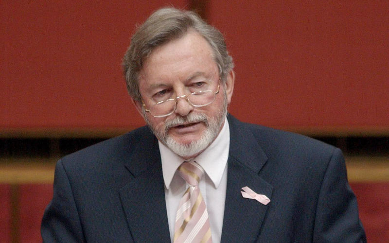 Canberra, October 23, 2002. Chairman of the Children Overboard inquiry Senator Peter Cook tables the inquiry report in the Senate chamber at Parliament House Canberra Image AAP Alan Porritt