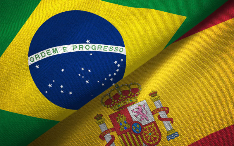 Spain and Brazil flags together relations textile cloth fabric texture. Image iStock Oleksii Liskonih