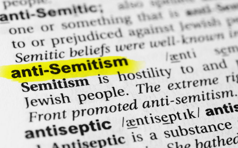 Highlighted English word anti semitism and its definition in the dictionary. Cropped. Image iStock Lobro78