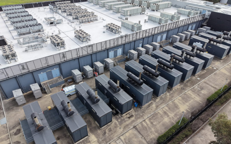 Data centre in Australia with server infrastructure and backup power generators stock photo. Image iStock GoAerials