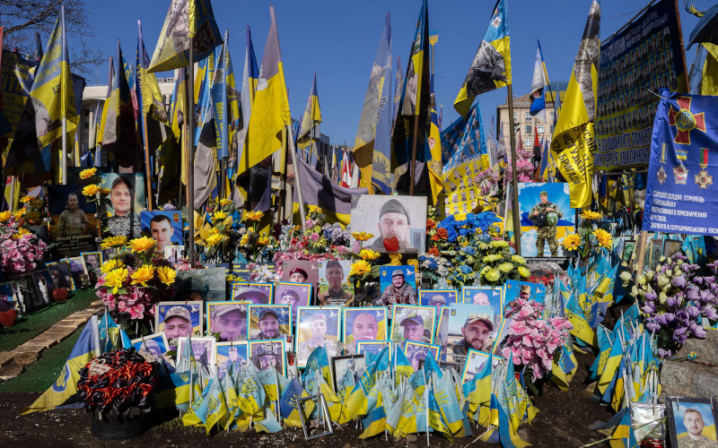 Kyiv, Ukraine March 15, 2026 A public tribute filled with Ukrainian flags and memorial photos of deceased soldiers, reflecting collective grief. Image Alamy Alina Vytiuk Image ID 3F93YXY