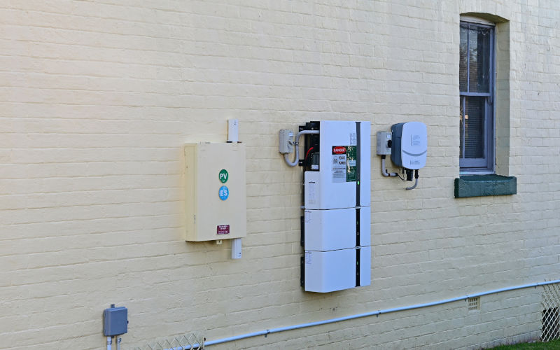Solar home battery and inverter on a house wall Australia. Image iStock Douglas Cliff