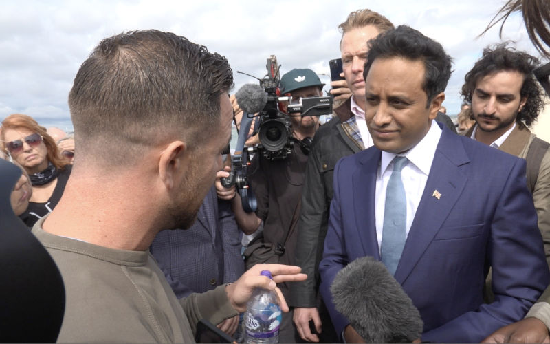 Patriot Platform founder Daniel Thomas, known as Danny Tommo speaking to Reform UK home affairs spokesman Zia Yusuf in Portsmouth, following a protest on Sunday after people thought to be migrants were brought into the harbour. Picture date Monday September 7, 2026.. Photo credit should read Theo Shaw PA Wire